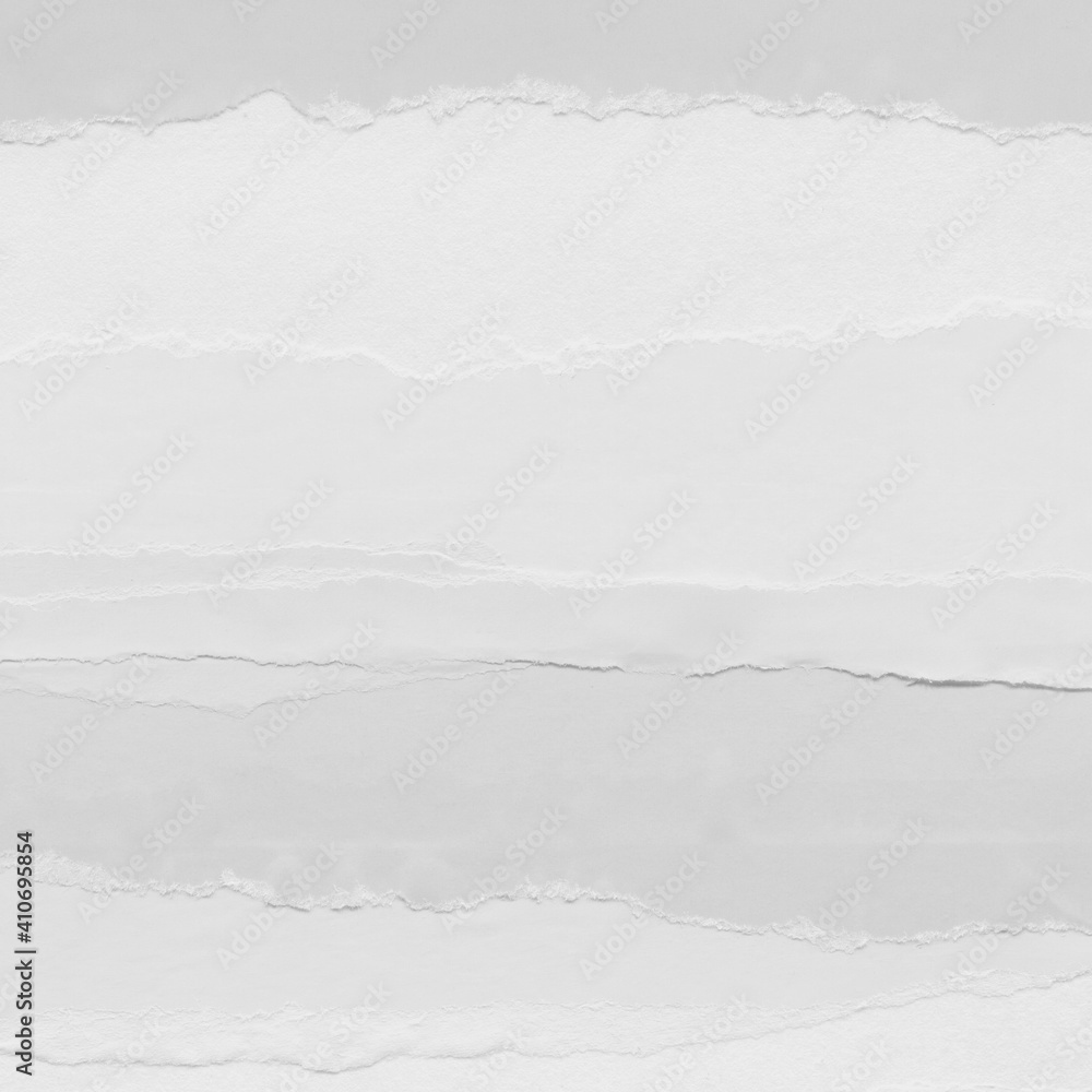 White torn paper collage close-up. Texture made from various paper and cardboard parts. Damaged old paper background. Vintage blank wallpaper. Material design backdrop. White torn paper collage close-up. Texture made from various paper and cardboard parts. Damaged old paper background. Vintage blank wallpaper. Material design backdrop.