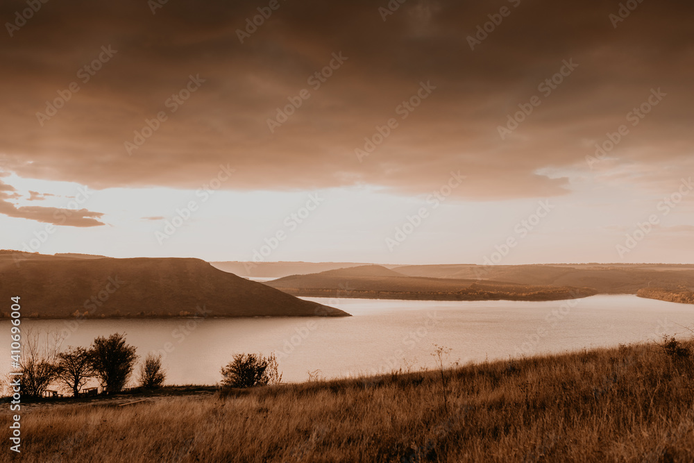 panoramic view from the cliff to the big river lake sea in the distance silhouettes of the islands