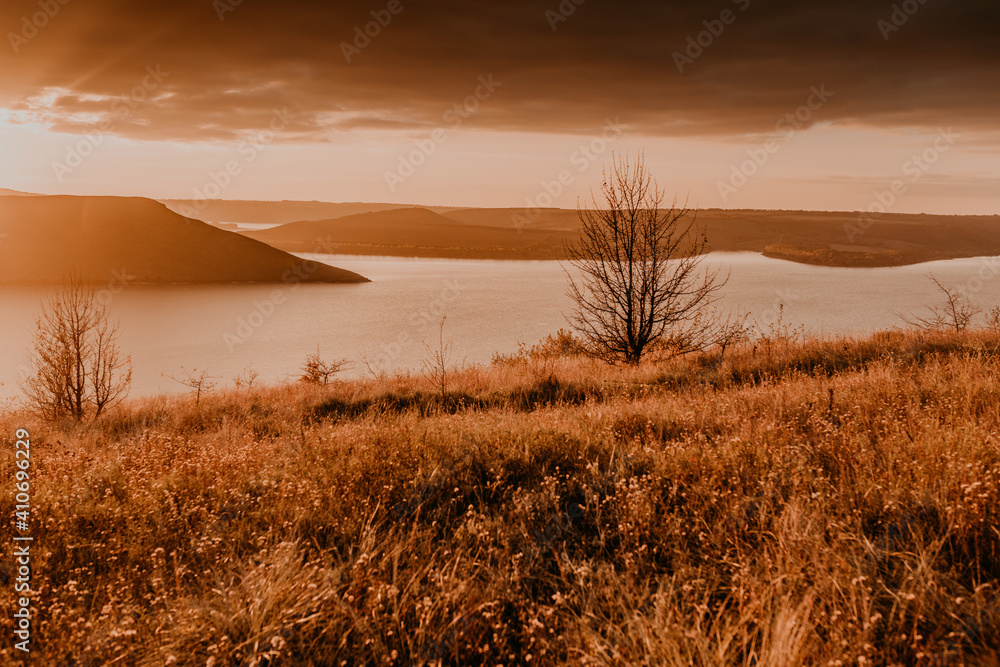 Fototapeta premium panoramic view from the cliff to the big river lake sea in the distance silhouettes of the islands