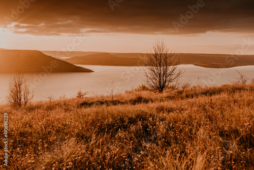 panoramic view from the cliff to the big river lake sea in the distance silhouettes of the islands