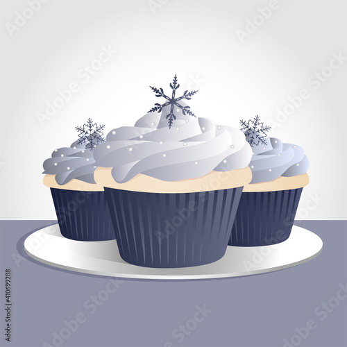 A trio of icy blue holiday cupcakes with snowflakes on top. Cupcakes on separate layer, easy to isolate.
