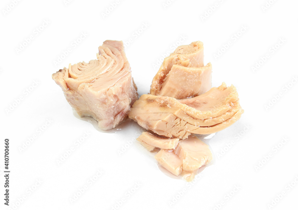 Pieces of tuna isolated on white background. Preserved and prepared fish meat Pieces of tuna isolated on white background. Preserved and prepared fish meat