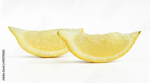 Two lemon slices isolated on white background. Healthy sour fruit