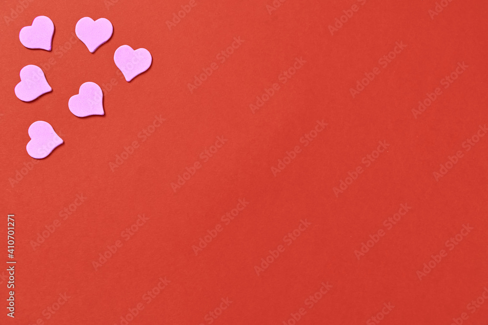 Lilac hearts frame on a red background. Love symbols for mother and valentine's day. There are many elements on the setup with place for text. High quality photo