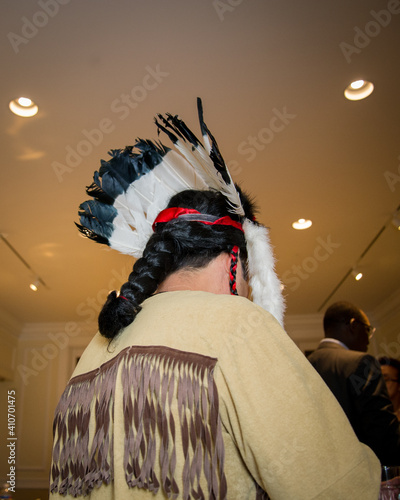 The back of a pilgrim's headdress with braided hair capotain English man photo