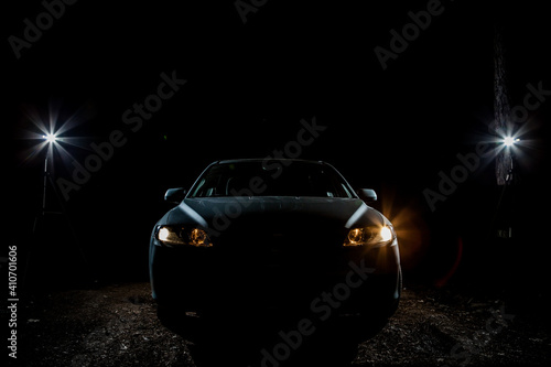 the headlights of an expensive car shine in the dark © KseniyaK
