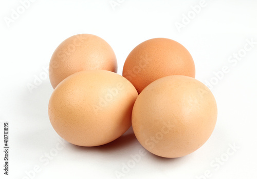 Group of uncooked eggs isolated on white background.