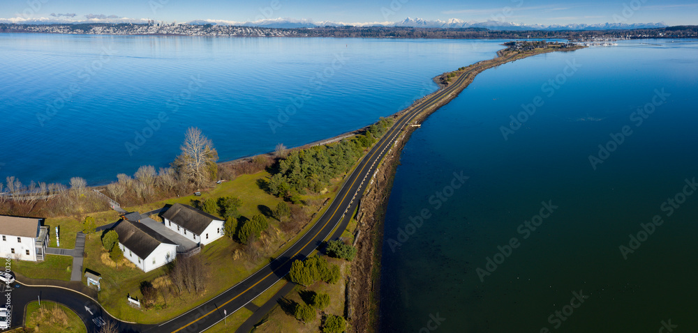 Semiahmoo Spit Leading to the Exclusive Resort and Marina. Aerial view of the Alaska Packer’s Cannery (APA) Museum at Semiahmoo County Park. The Canadian city of White Rock is in the background.