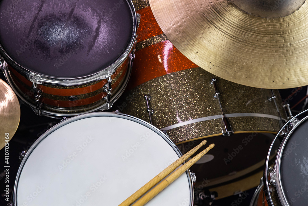 Closeup of drumsticks lying on the professional drum set. Drummer equipment. Closeup of drumsticks lying on the professional drum set. Drummer equipment.