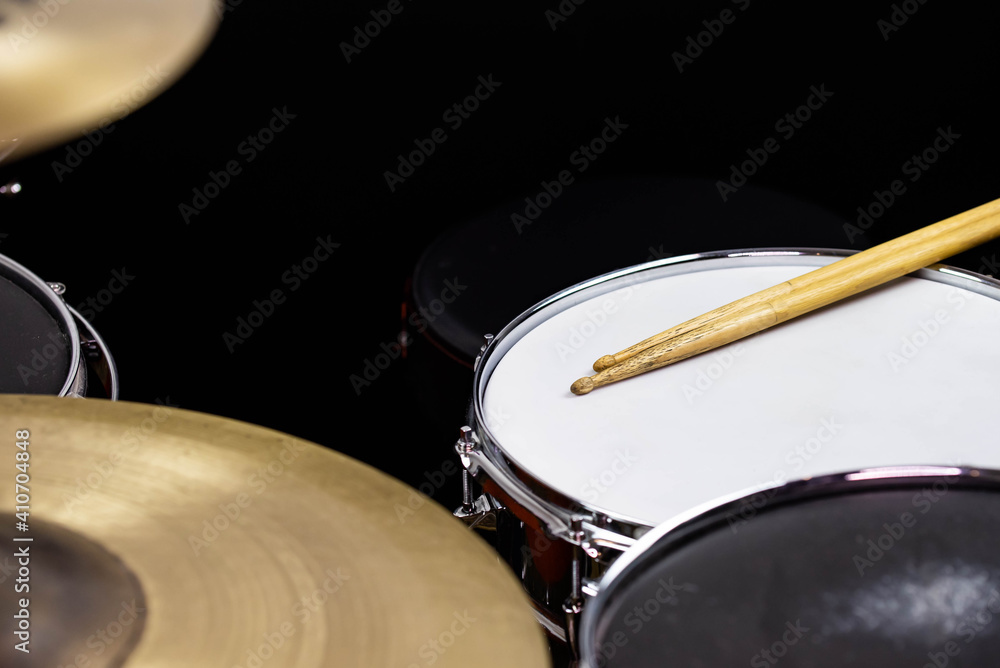 Fototapeta premium Closeup of drumsticks lying on the professional drum set. Drummer equipment. 