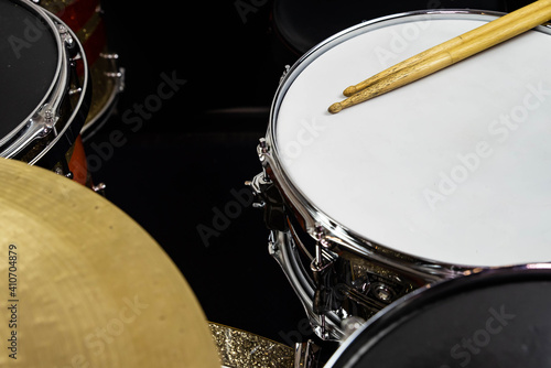 Closeup of drumsticks lying on the professional drum set. Drummer equipment. 