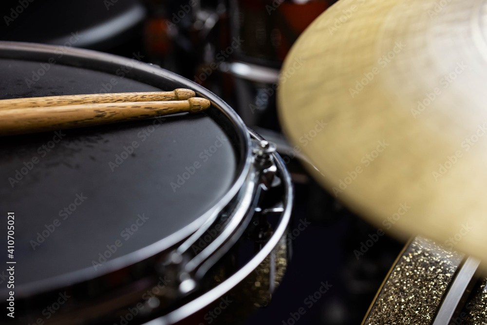 Fototapeta premium Closeup of drumsticks lying on the professional drum set. Drummer equipment. 
