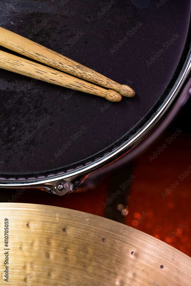 Obraz premium Closeup of drumsticks lying on the professional drum set. Drummer equipment. 