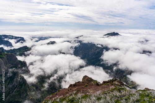 Beautiful mountain scenery near the mountain peak Pico Ruivo on Madeira Island - Cloud covered mountain landscape photo