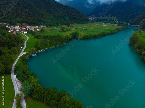 Aerial view of Most Na Soci lake in beautiful colors near Tolmin in Slovenia. Summer cloud day. Travel and vacation. Copy space
