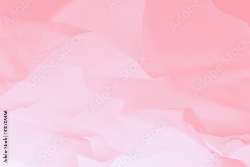 Wavy pink fabric, light abstract blurred background