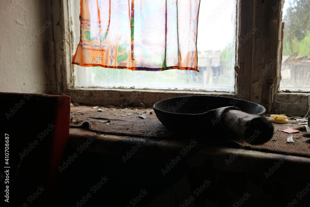 interior of old abandoned house in russian outback with forgotten things