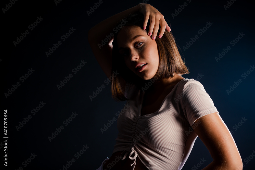 Attractive woman happy smile isolated over dark background