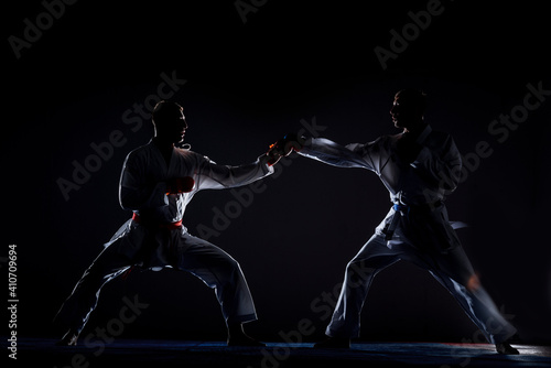 Two karate guys is practicing martial arts in sport gym © qunica.com
