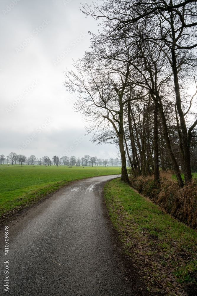 Slatsdijk (Swamp Dike) running through the fields surrounding Loenen, at the edge of Veluwe and IJsselvallei (IJssel Valley) in The Netherlands