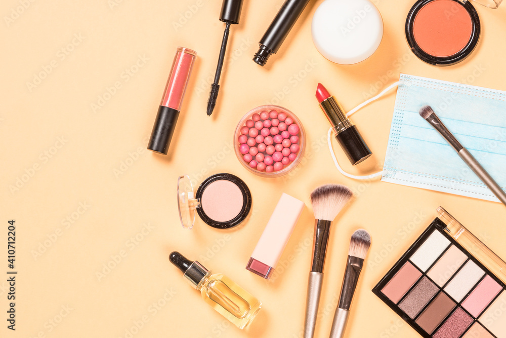 Make up products and face mask New normal concept. Flat lay image with copy space. Make up products and face mask New normal concept. Flat lay image with copy space.