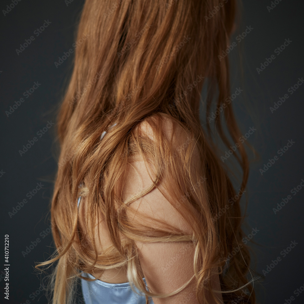 Woman with long wavy blond hair goosebumps on arm Woman with long wavy blond hair goosebumps on arm