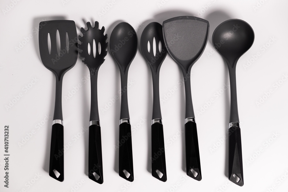 Stand with set of kitchen utensils. Isolated on a white background Stand with set of kitchen utensils. Isolated on a white background