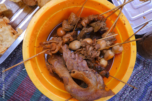 Traditional angkringan satay menu (egg satay and chicken head satay). This satay is commonly found in Yogyakarta and around Central Java, Indonesia  photo