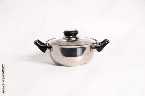 Stainless steel stewpot on white background