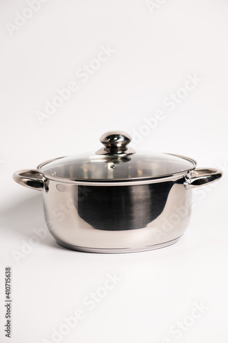 Stainless steel stewpot on white background