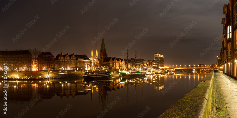 Panorama of the Schlachte at the river Weser in Bremen, Germany with the ancient city centre and the st. petri Dom in the background at night