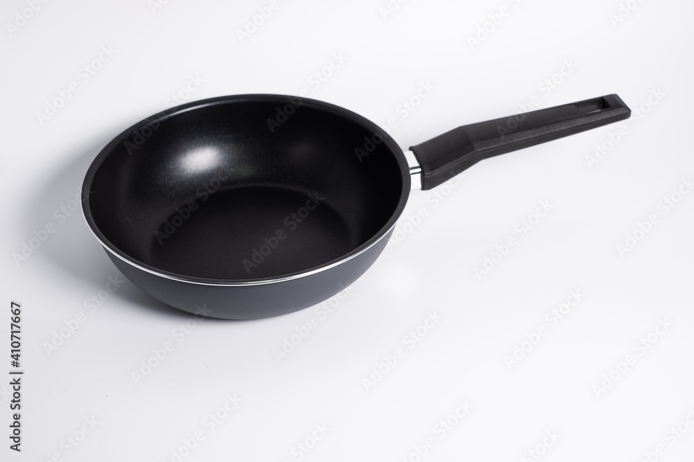 black frying pan isolated on a white background black frying pan isolated on a white background