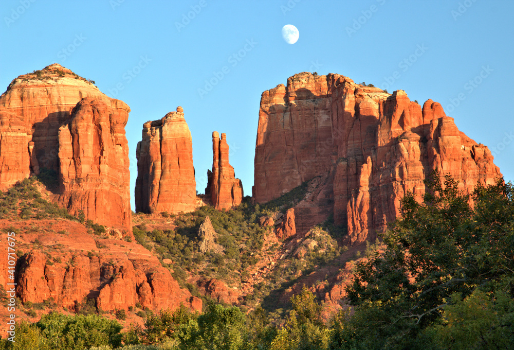 Cathedral Rock at sunset with the moon above the rock formation