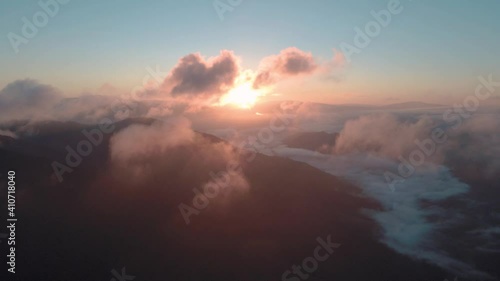 Epic flight through the pink sunset clouds
