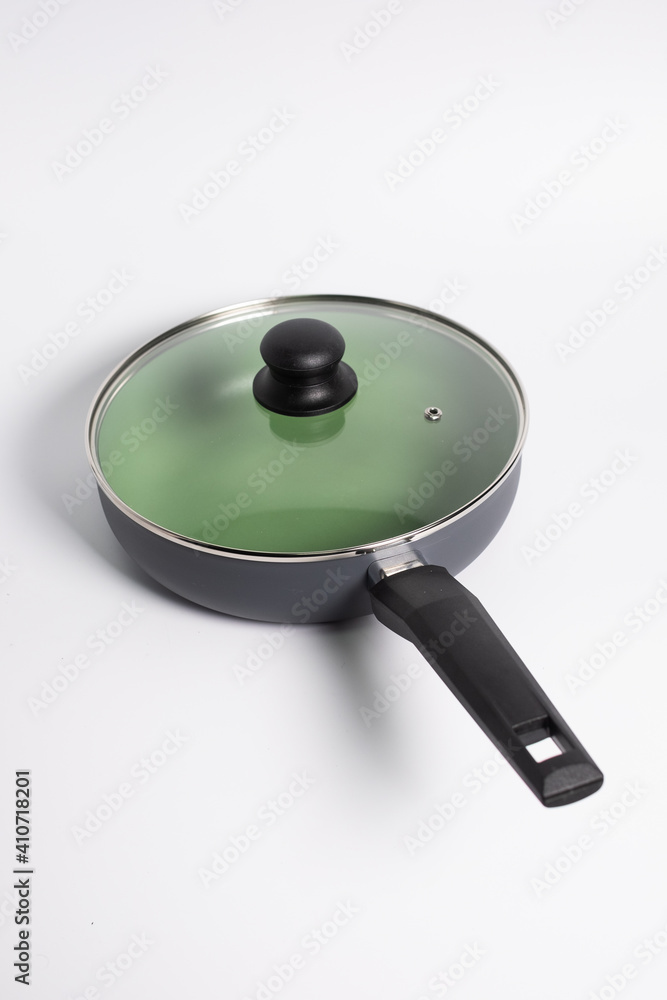 green grill pan isolated on a white background green grill pan isolated on a white background