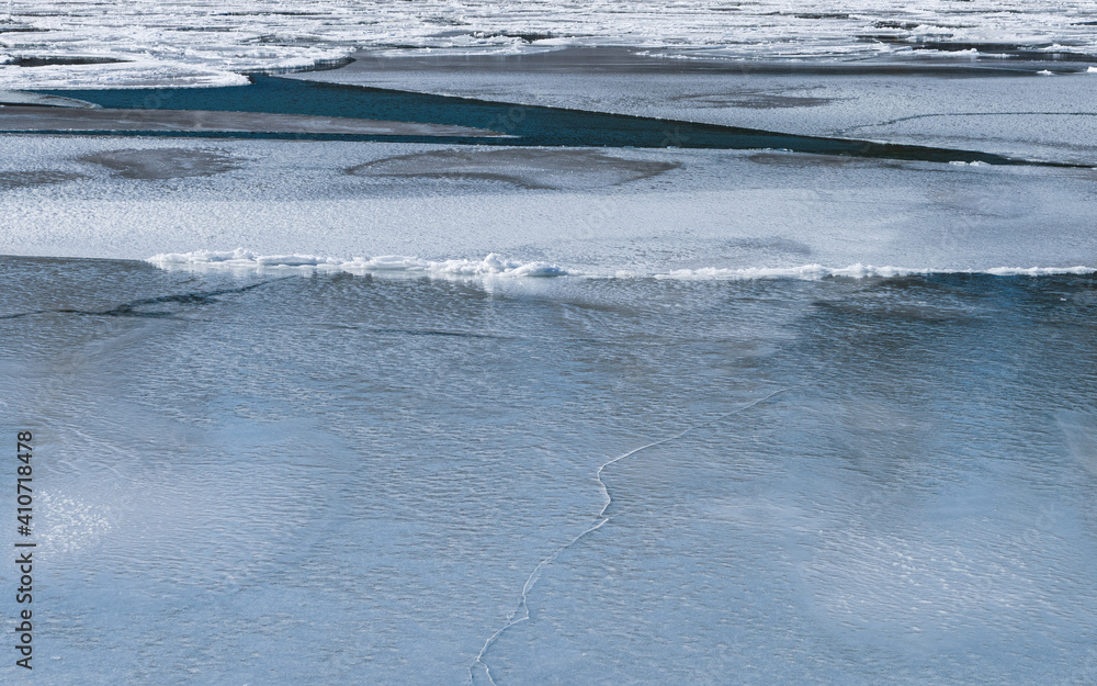 Beautiful abstract ice patterns in frozen stream
Beautiful abstract ice patterns in frozen stream