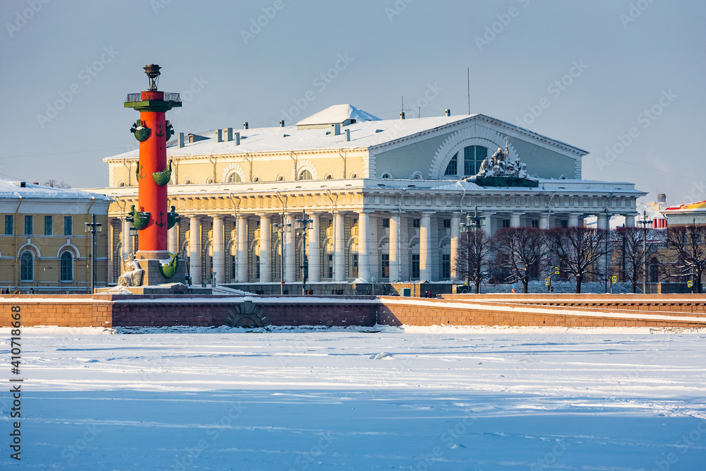 Roman-style columns - Rostralnaya Kolonna on Vasilyevsky island. Sights of St. Petersburg. Winter in the city on the Neva in Russia
