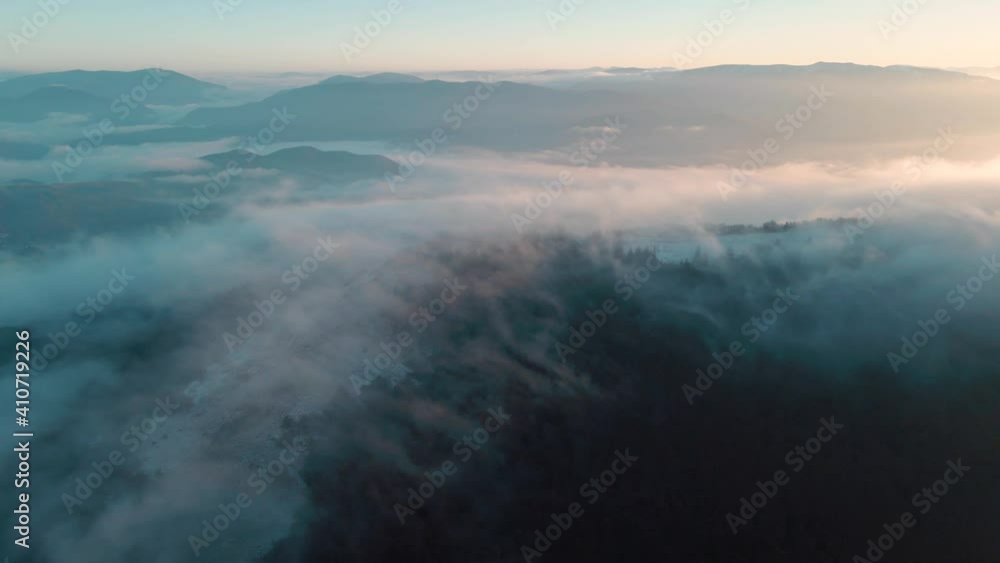 Mountain hills and valleys covered by fog Mountain hills and valleys covered by fog