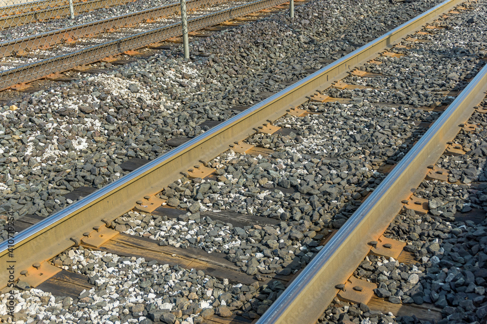 Naklejka premium Close up view of railroad tracks at ground level