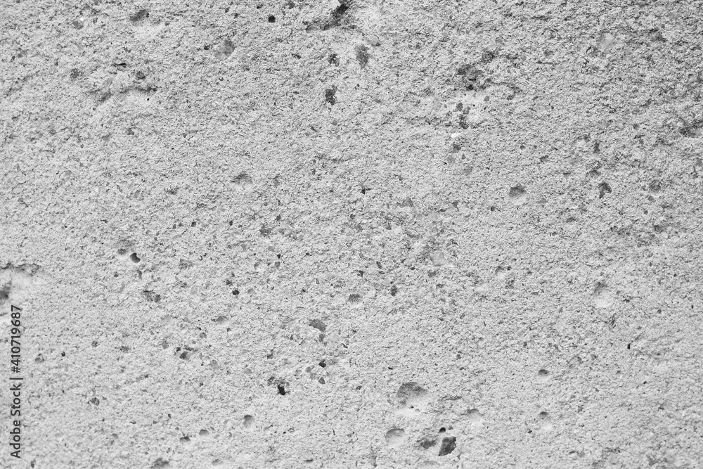 Texture of gray concrete with recesses of different sizes Texture of gray concrete with recesses of different sizes