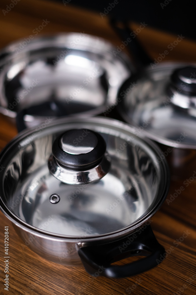 set of pots on wooden background set of pots on wooden background