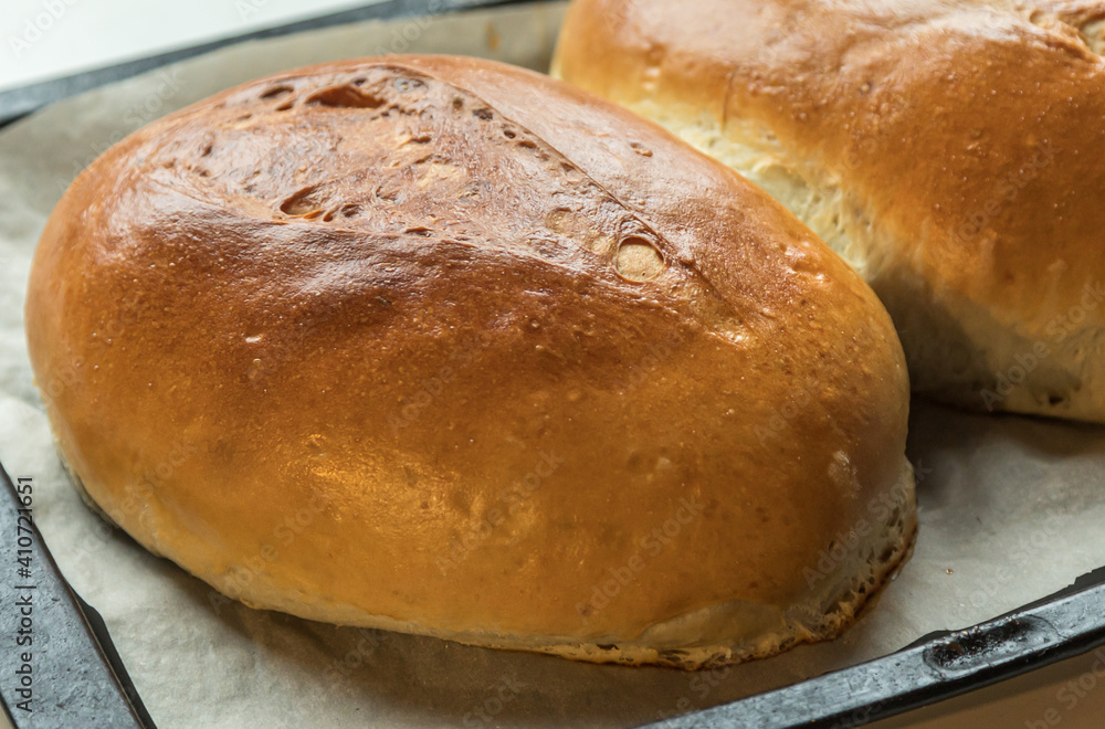 Fototapeta premium Yeast buns on a baking sheet