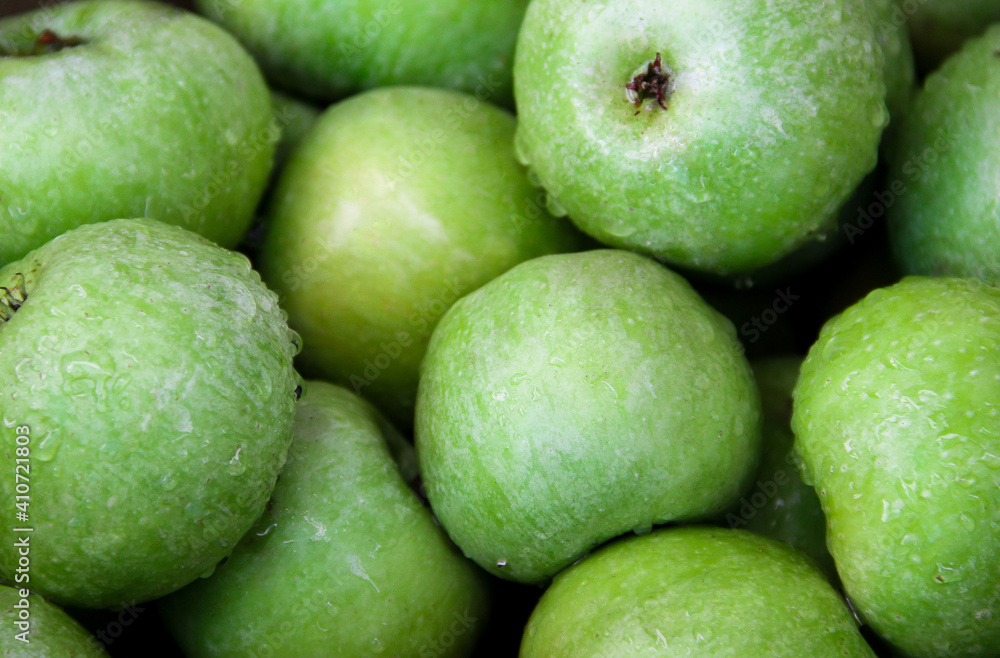Apple background for designers. Green apples after rain Apple background for designers. Green apples after rain