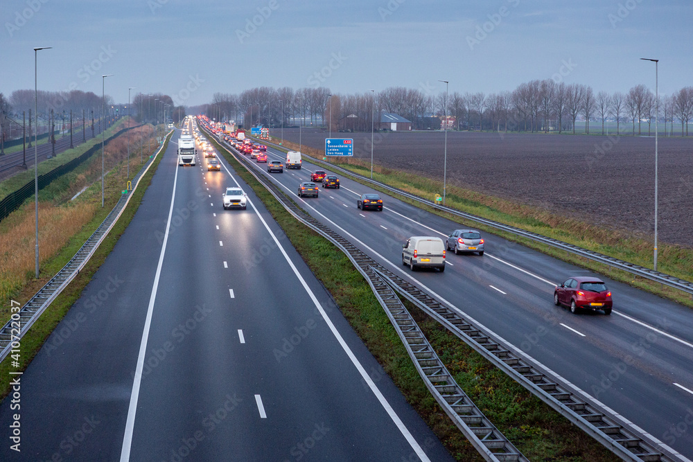 Cars driving in the evening on the A44 highway to the village of Sassenheim, Abbenes and Kaag in the Netherlands.