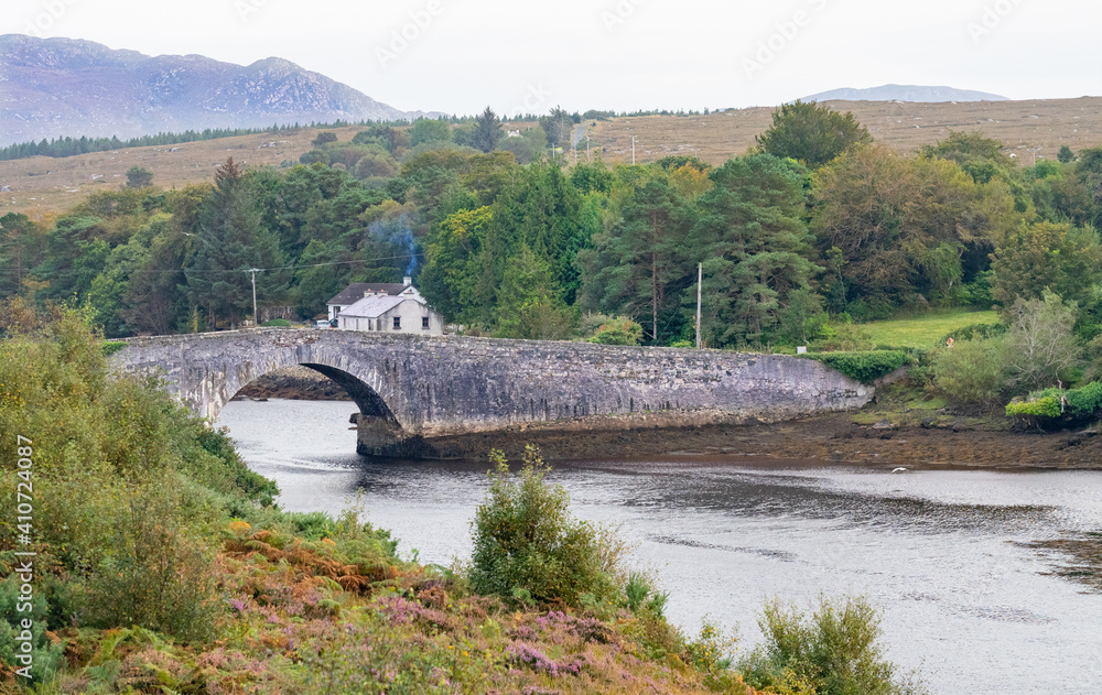 Old stone bridge and cottages in Ireland