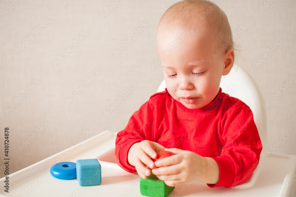 little girl plays and cries, all in tears. High quality photo little girl plays and cries, all in tears. High quality photo