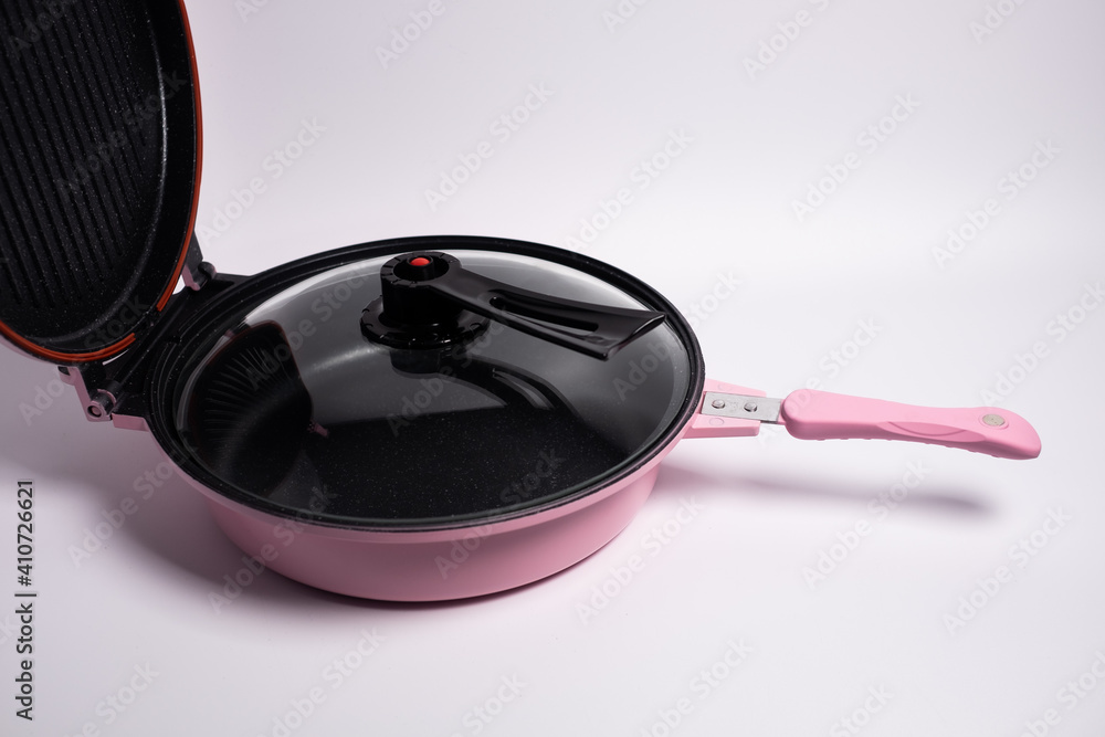 pink double sided grill pan isolated on a white background pink double sided grill pan isolated on a white background