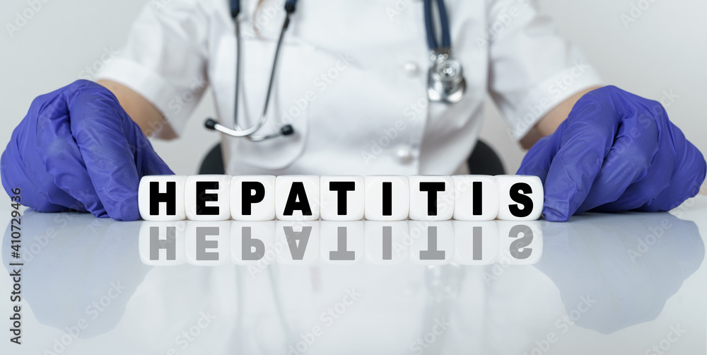 The doctor put together a word from cubes HEPATITIS The doctor put together a word from cubes HEPATITIS