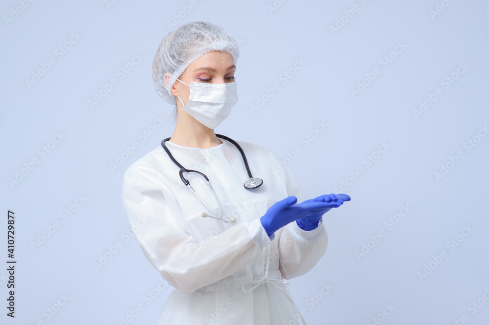Portrait of a female doctor or nurse wearing medical cap and face mask Portrait of a female doctor or nurse wearing medical cap and face mask