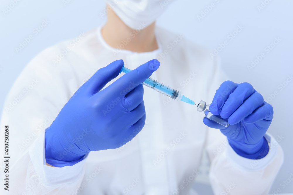 Fototapeta premium Doctor filling syringe with medication, closeup. Vaccination and immunization